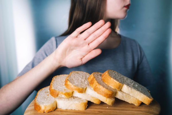 Woman Refusing Bread Due To Gluten Allergy