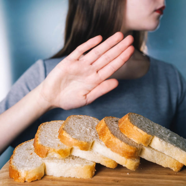 Woman Refusing Bread Due To Gluten Allergy